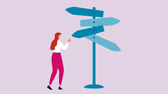 Woman looking at signpost