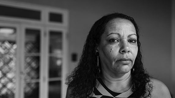 Table 2 - 2023/24 management expenses split by PRA and FCA classes Lady in front of glass doors