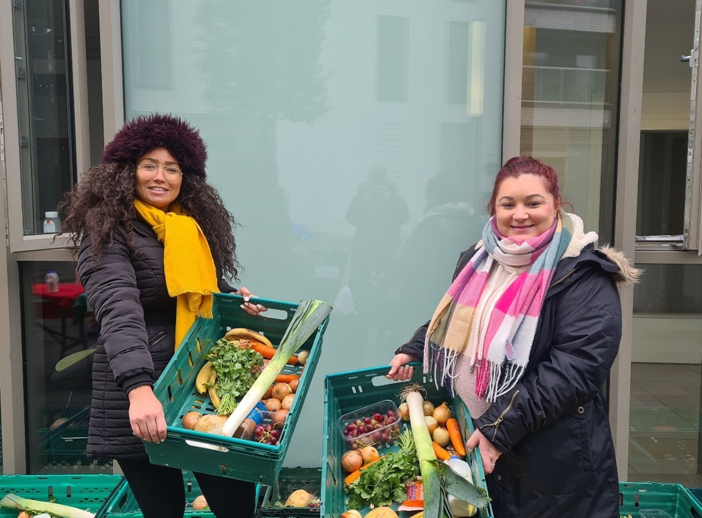 FSCS Compensation Administrator, Afreeca Taiwo, and Insurance Specialist, Steph Turpin, preparing donation boxes for local residents on 3 December