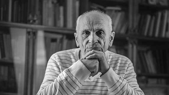 Elderly man in library