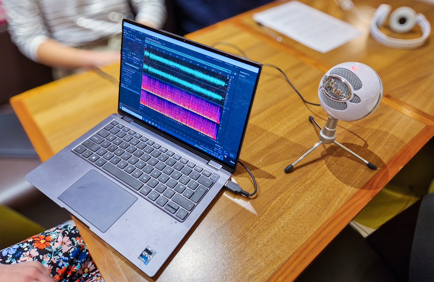 Editing a podcast episode on a laptop