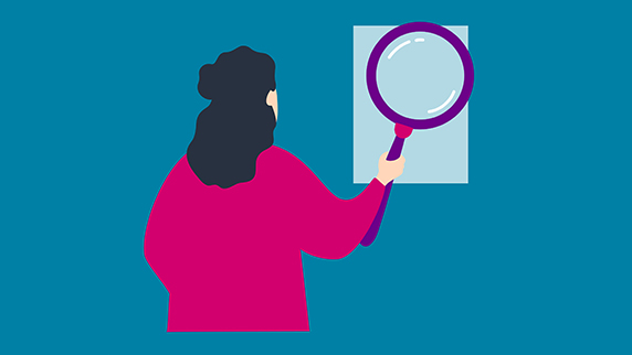 Woman with an out-sized magnifying glass