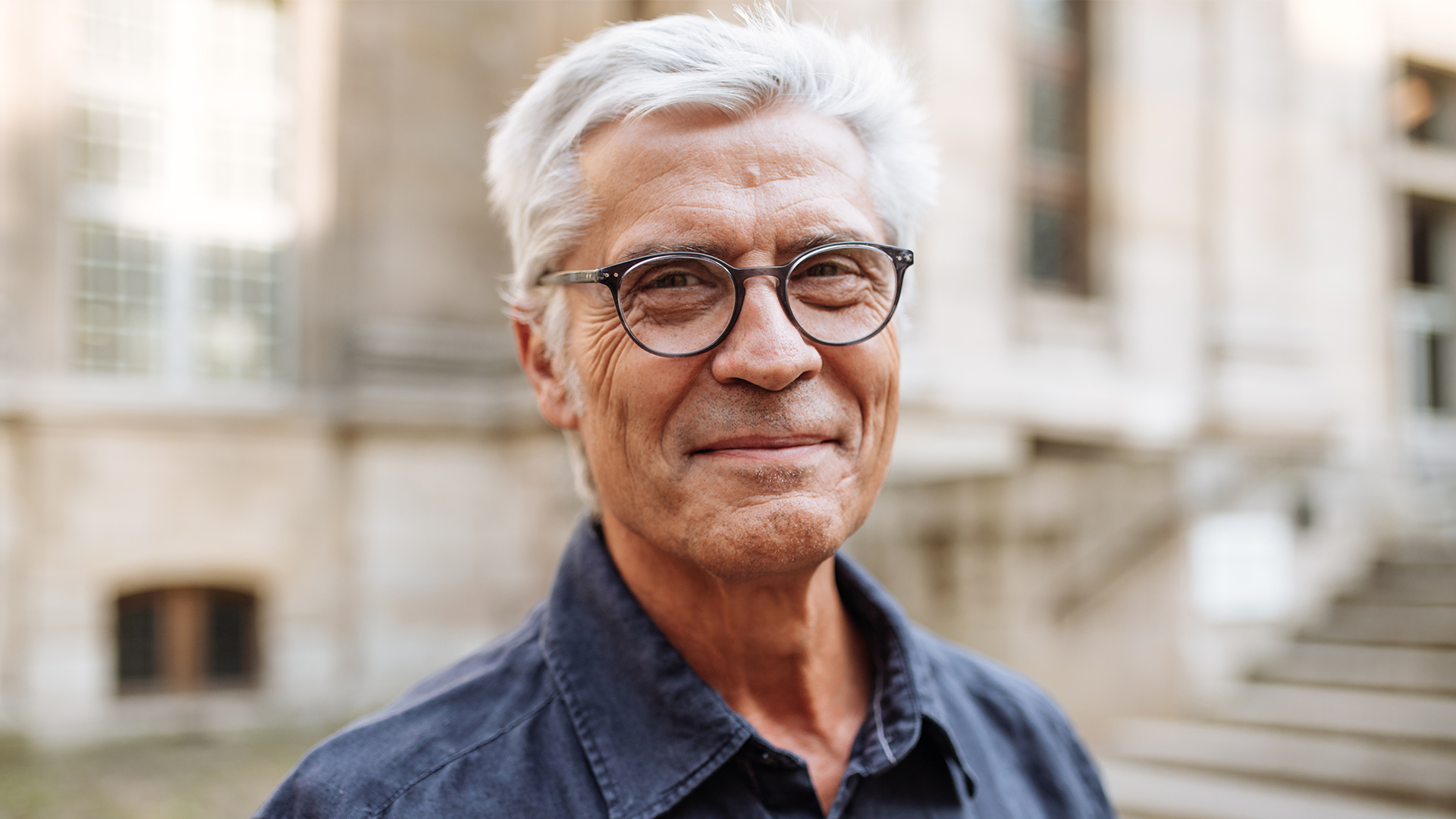 Elderly man smiling at camera