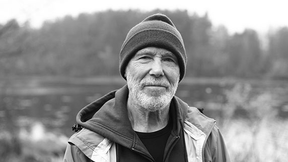 Man in warm clothing in countryside