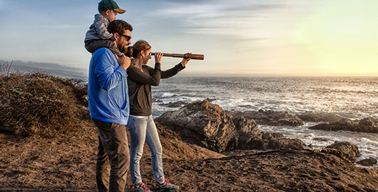 Lady looking through telescope