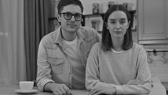 Young couple standing next to each other