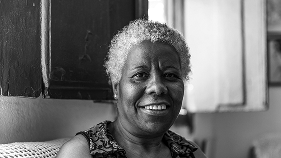 Grey haired lady smiling at camera