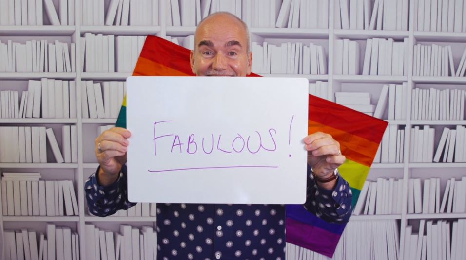 Video snapshot of employee holding a board saying 'fabulous' to represent FSCS as a diverse and inclusive employer