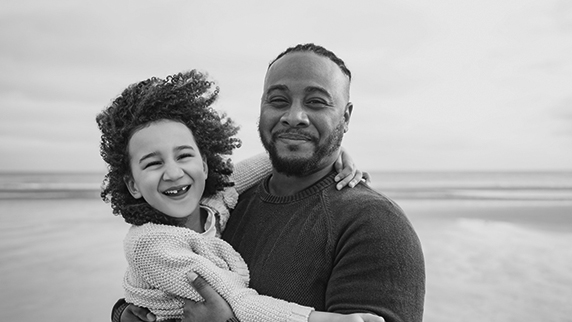 Man with child on beach
