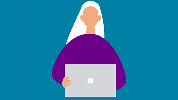 White haired woman using a laptop