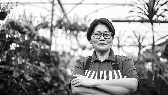 Lady wearing apron in a garden centre