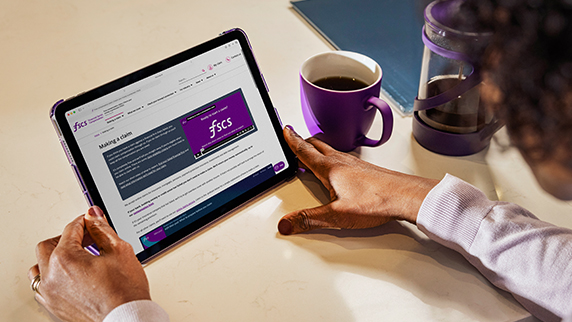 Woman on laptop making a claim